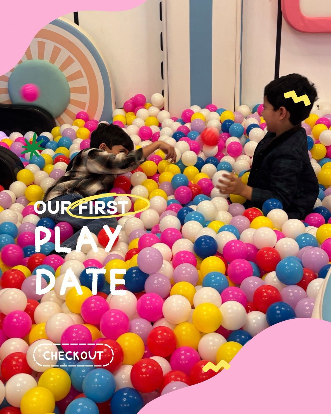 Two young boys play in a ball pit, with text overlay "OUR FIRST PLAY DATE".