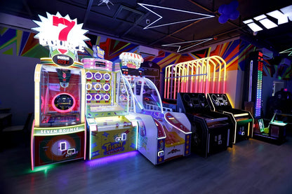 Arcade with colorful, glowing games like "Seven Bounce" and "Ticket Champ."