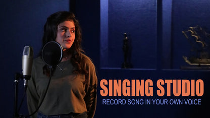 A young woman stands in a recording studio with a microphone, ready to sing. Text reads "SINGING STUDIO RECORD SONG IN YOUR OWN VOICE."