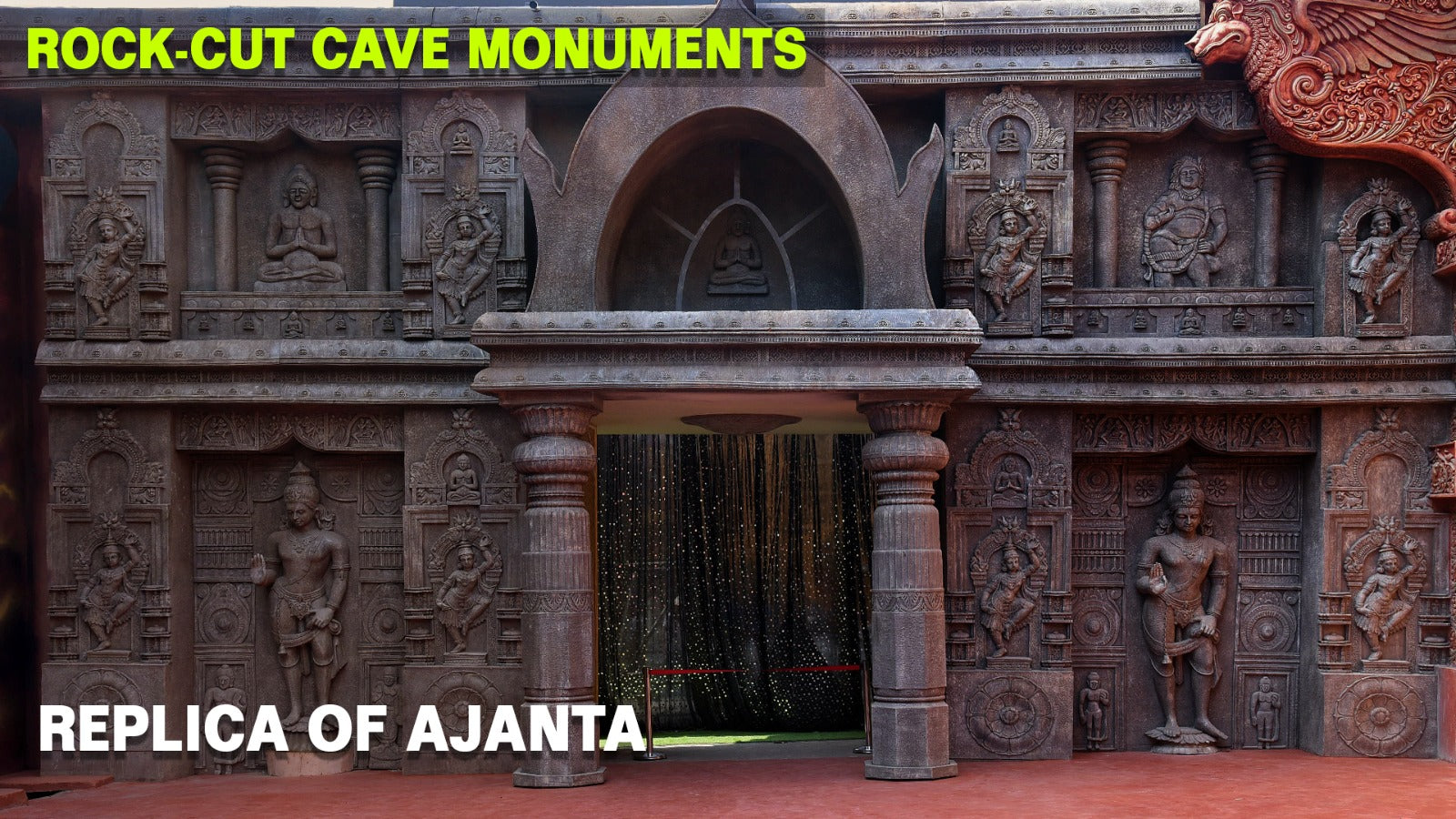 A replica of Ajanta Caves with intricate carvings and statues.