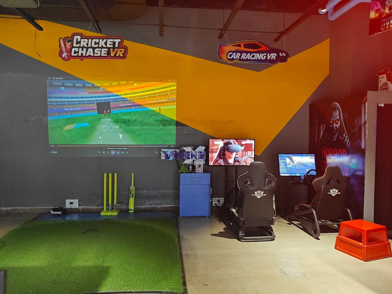 VR gaming arcade with cricket and car racing simulators.