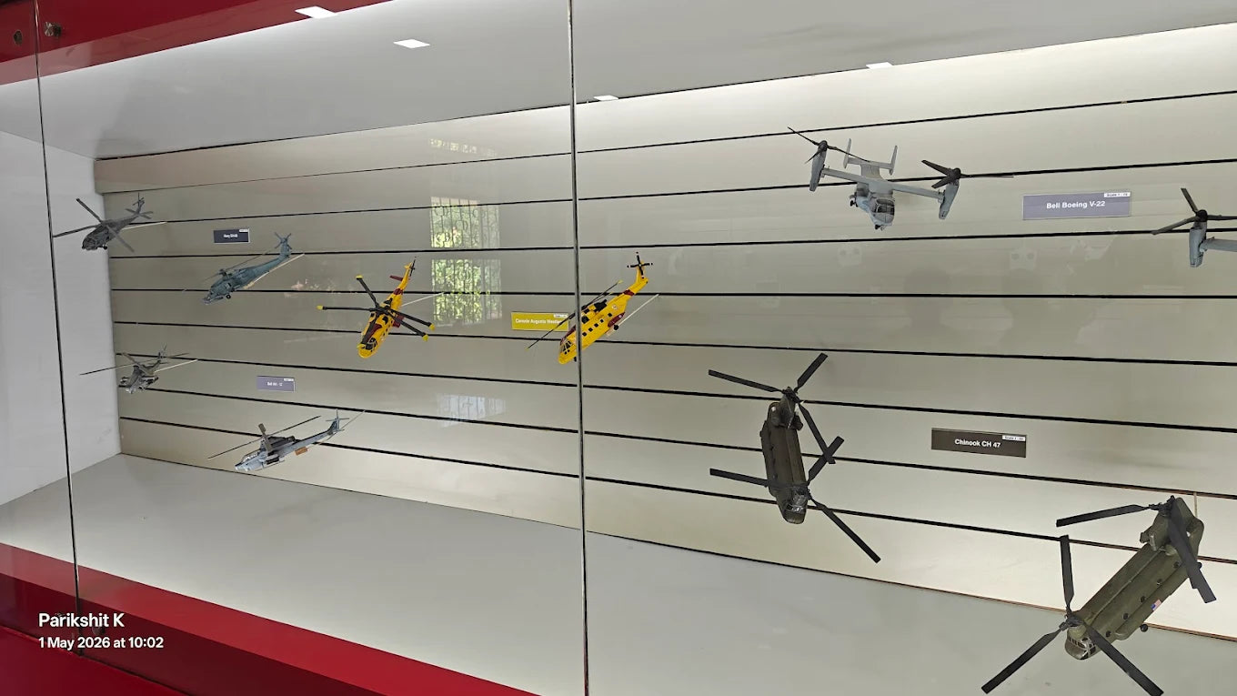 Model helicopters displayed in a museum exhibit.