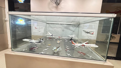 A display case filled with model airplanes, showcasing various aircraft designs.
