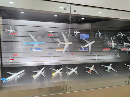 A display case filled with model airplanes of various airlines.