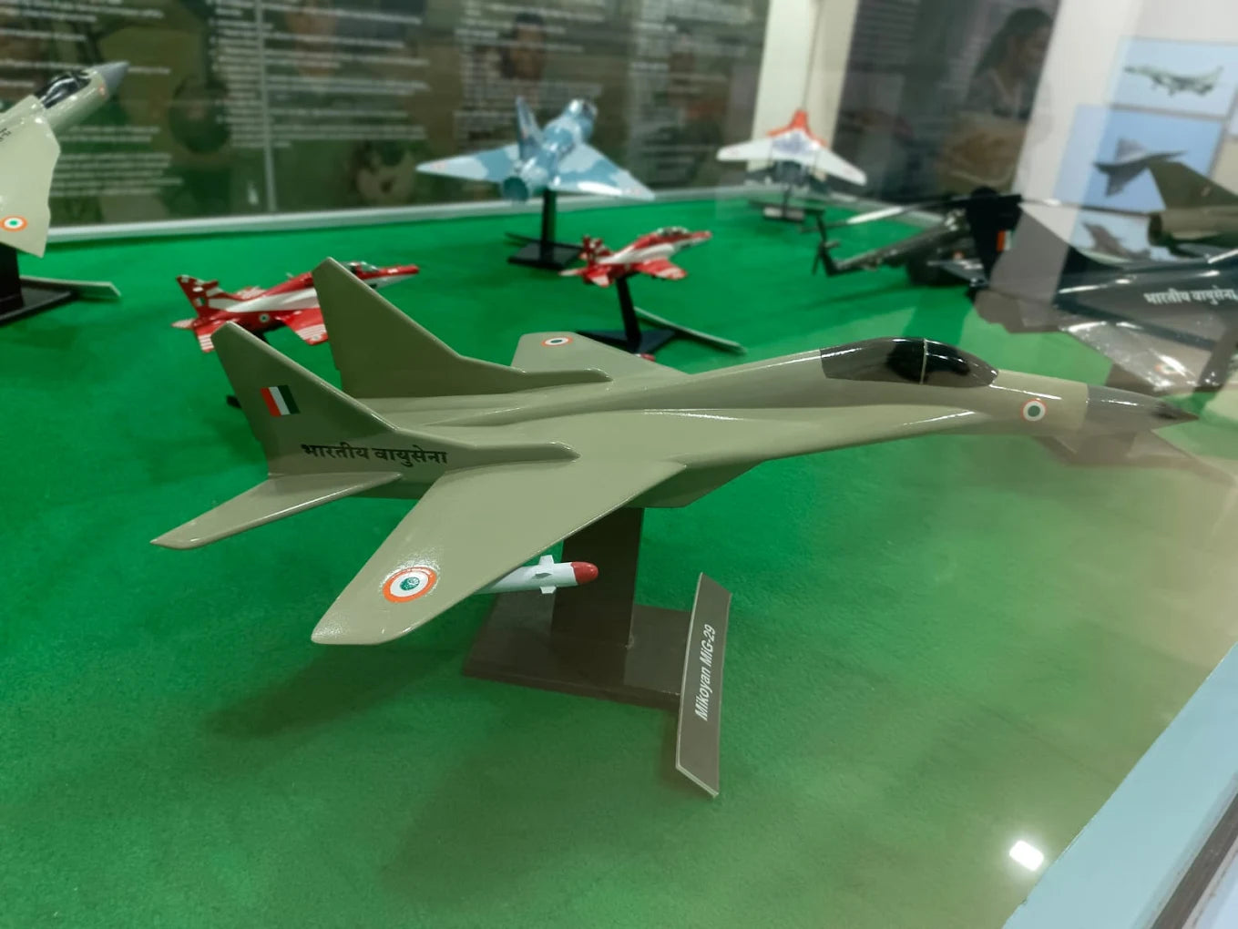 Model airplanes on display, including a prominent MiG-29 with Indian Air Force markings.