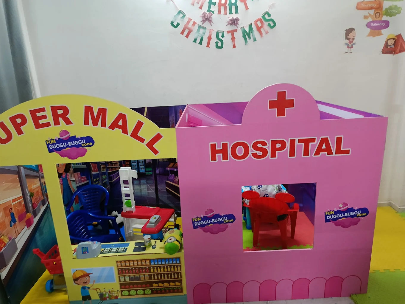 Children's playhouse with a "Super Mall" and "Hospital" section.