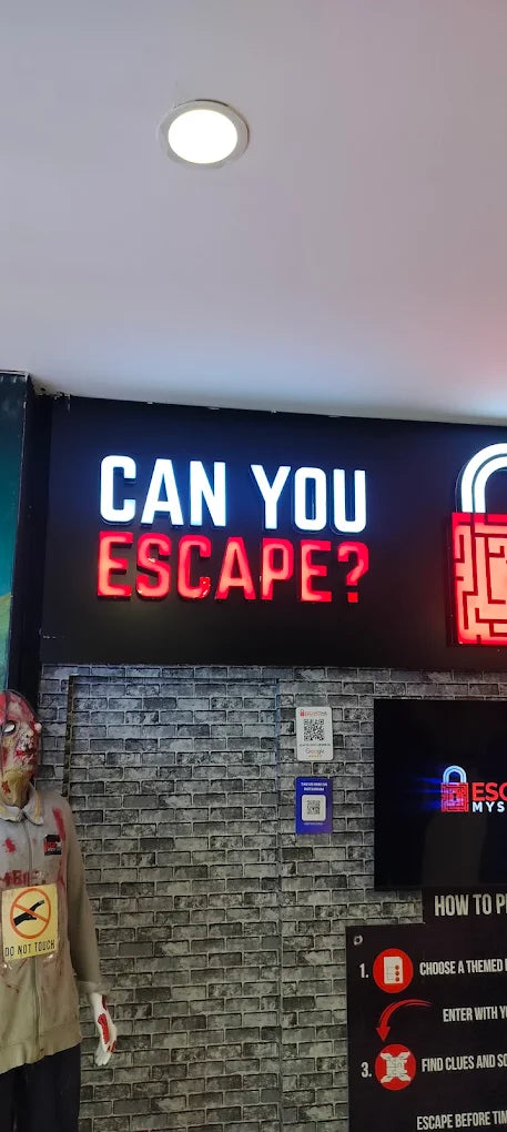 A neon sign reads "CAN YOU ESCAPE?" in front of a brick wall, with a zombie mannequin and instructions for an escape room.