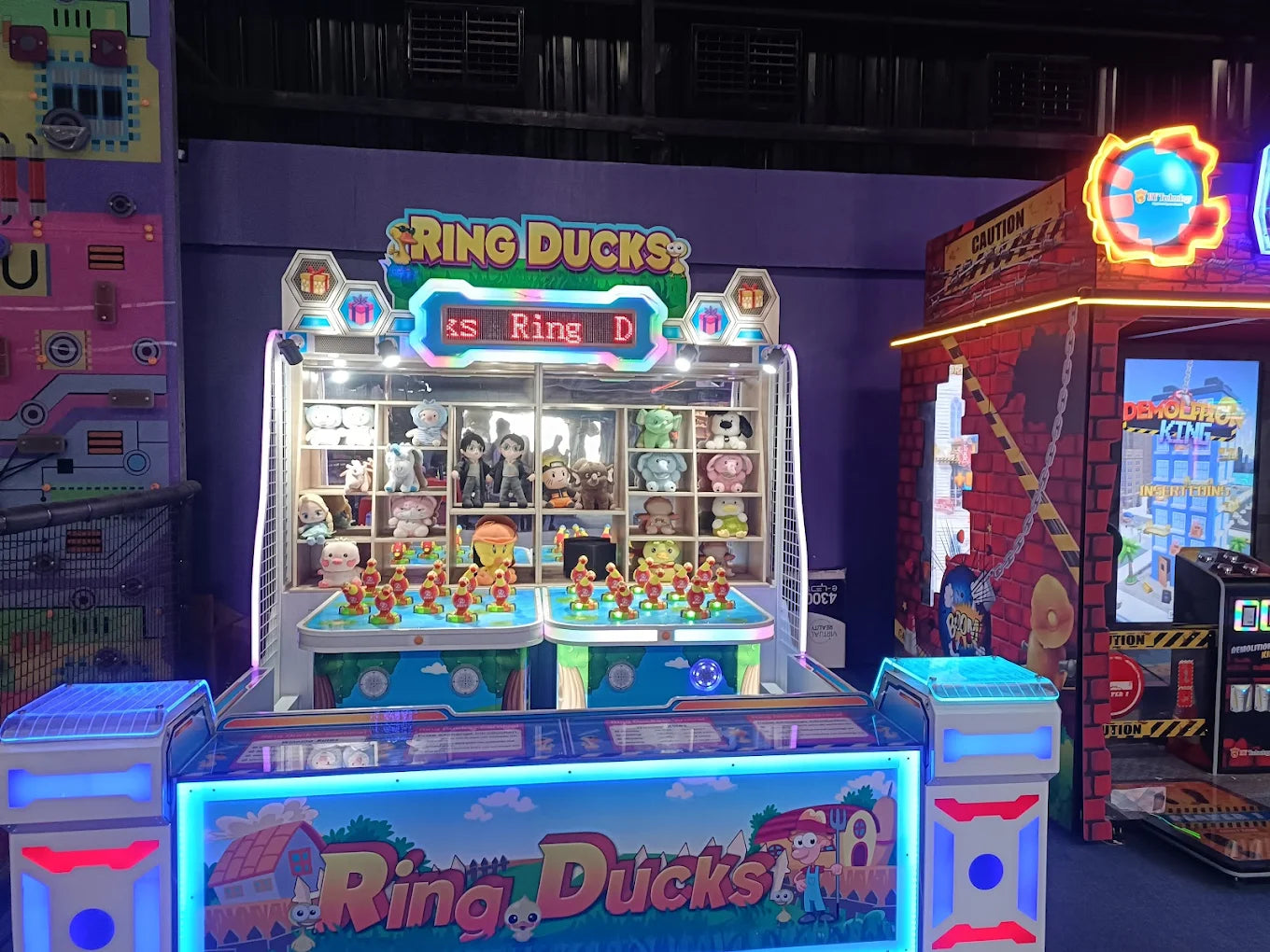 Arcade game with plush toys and a ring toss.