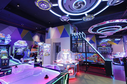 Colorful arcade room with various games and neon lights