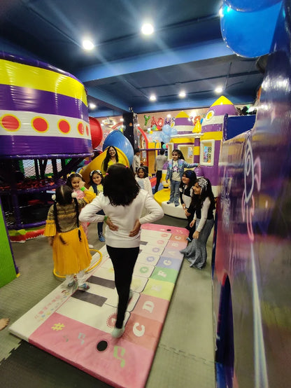 Group of children playing on giant floor piano and colorful play structures inside Fun Orbbit Kids Play Area Gujranwala Town Delhi