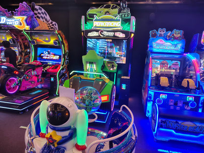 Arcade with racing games and a child-sized ride.