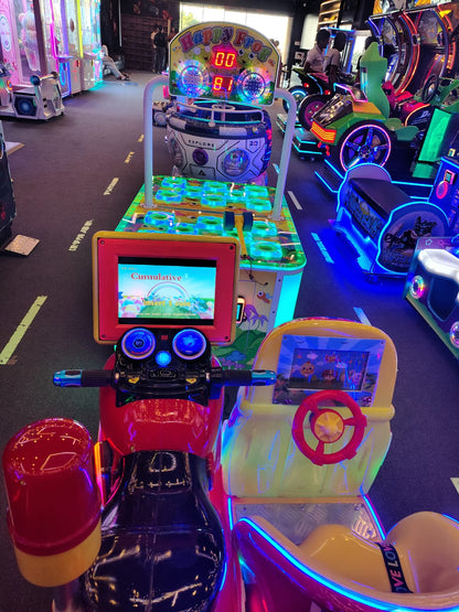 Arcade game with a red motorcycle ride and a "Happy Frog" game.