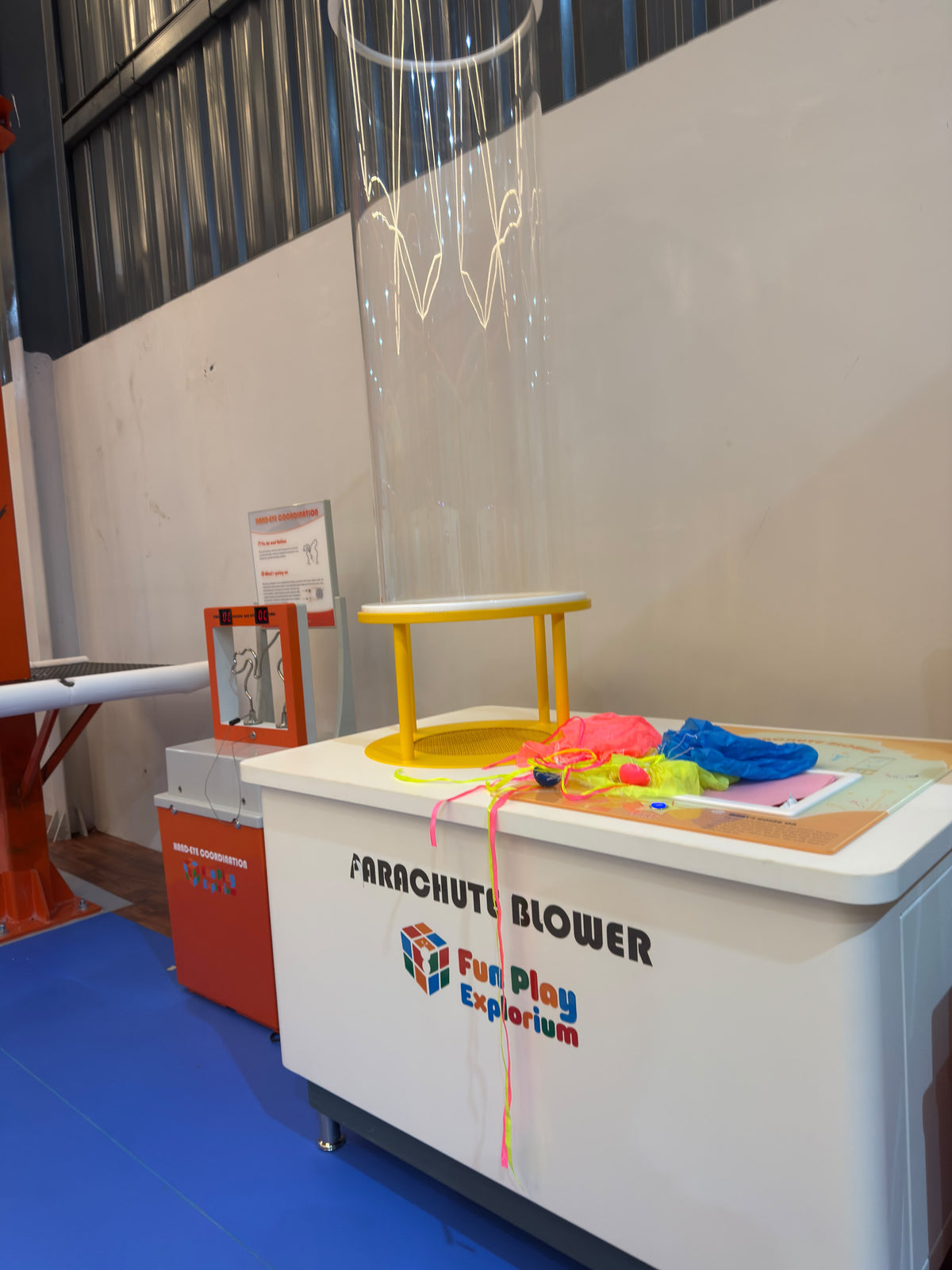 A "Parachute Blower" exhibit with colorful parachutes and a clear tube.