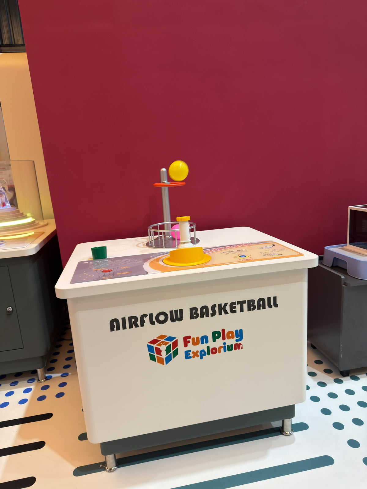 An airflow basketball game for children at an explorium.