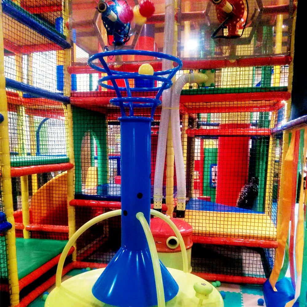 A colorful indoor playground with a basketball hoop and slides, likely for young children.