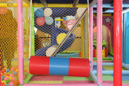 A colorful indoor playground with a ball pit, slide, and soft play equipment for young children.