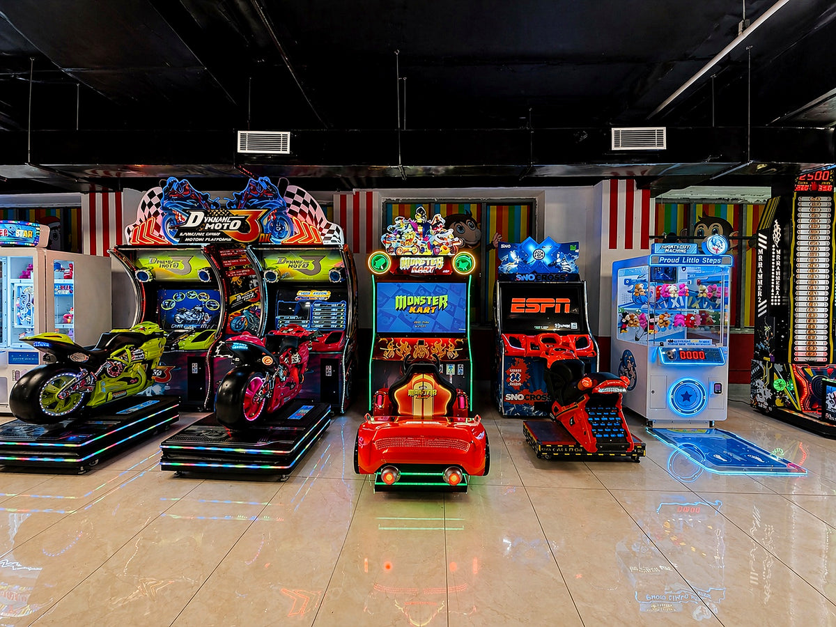 Arcade with various racing games, including motorcycle and car simulators, for children and adults.