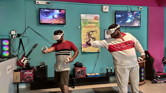 Two young men play a VR batting simulator game in a brightly colored arcade.