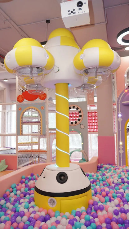A colorful ball pit with a large, mushroom-shaped structure in the center, likely in a children's play area.