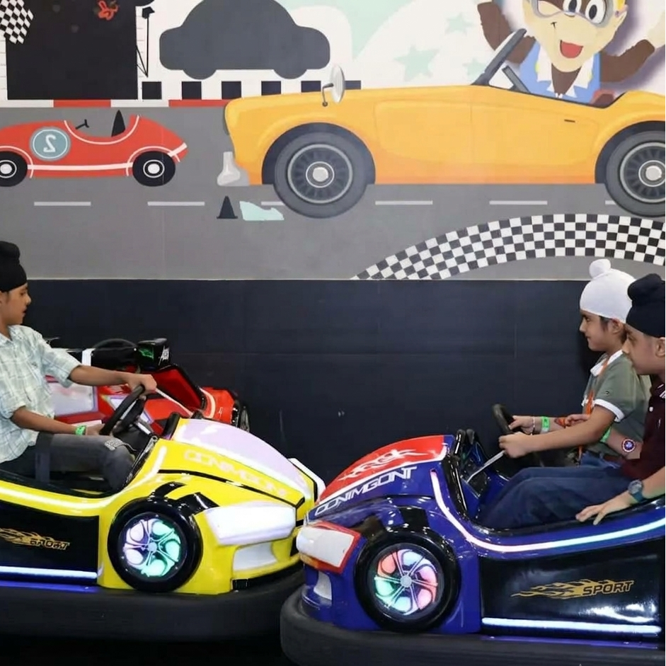 Children in bumper cars at an amusement park.