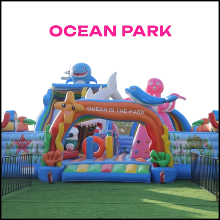 An inflatable ocean-themed playground with children playing.