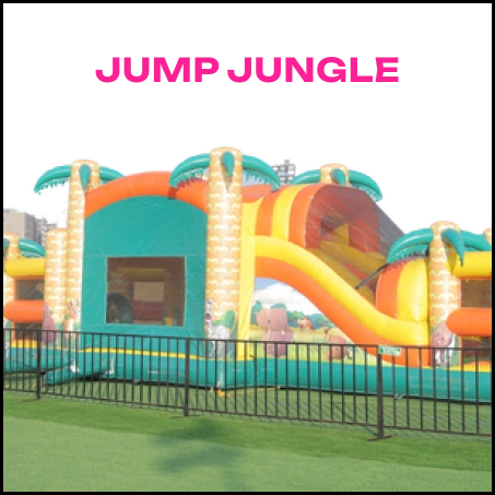 A colorful inflatable jungle-themed bounce house with a slide, set up on a grassy field.