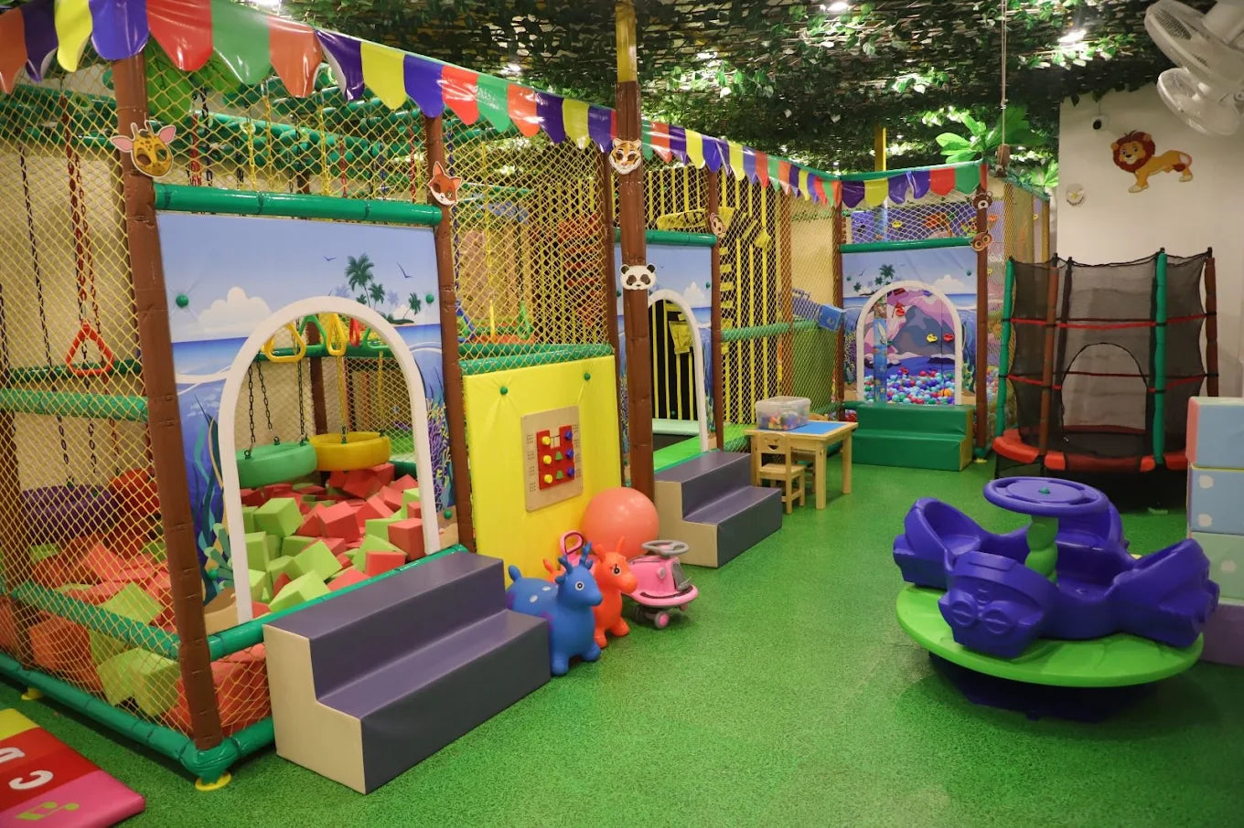 Children's play area with colorful equipment and soft surfaces