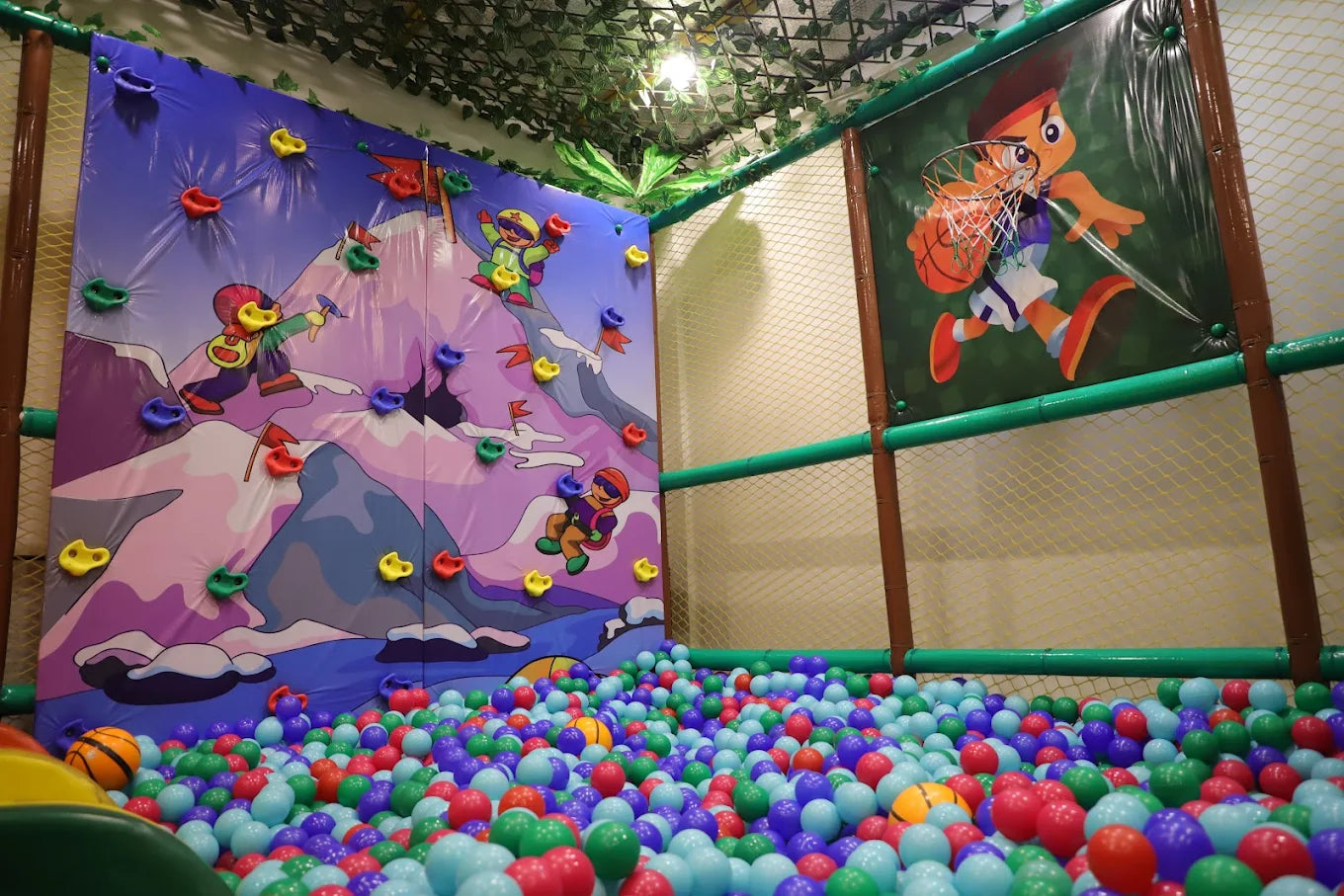Indoor play area at Jumping Jollies Sector 104 Hazipur Noida with colorful climbing wall and ball pit