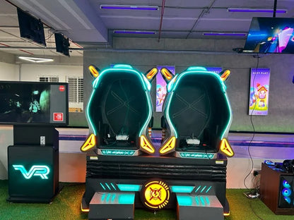 Two futuristic VR gaming chairs with neon lights in an arcade.