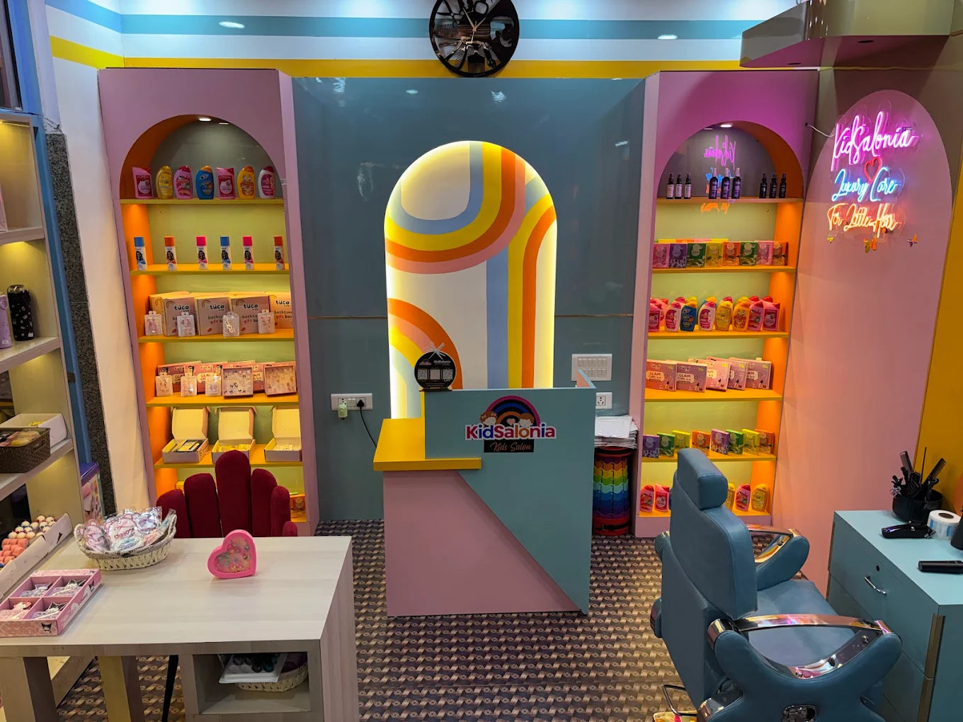 Children's play area with colorful decor, toys, and a toy machine.