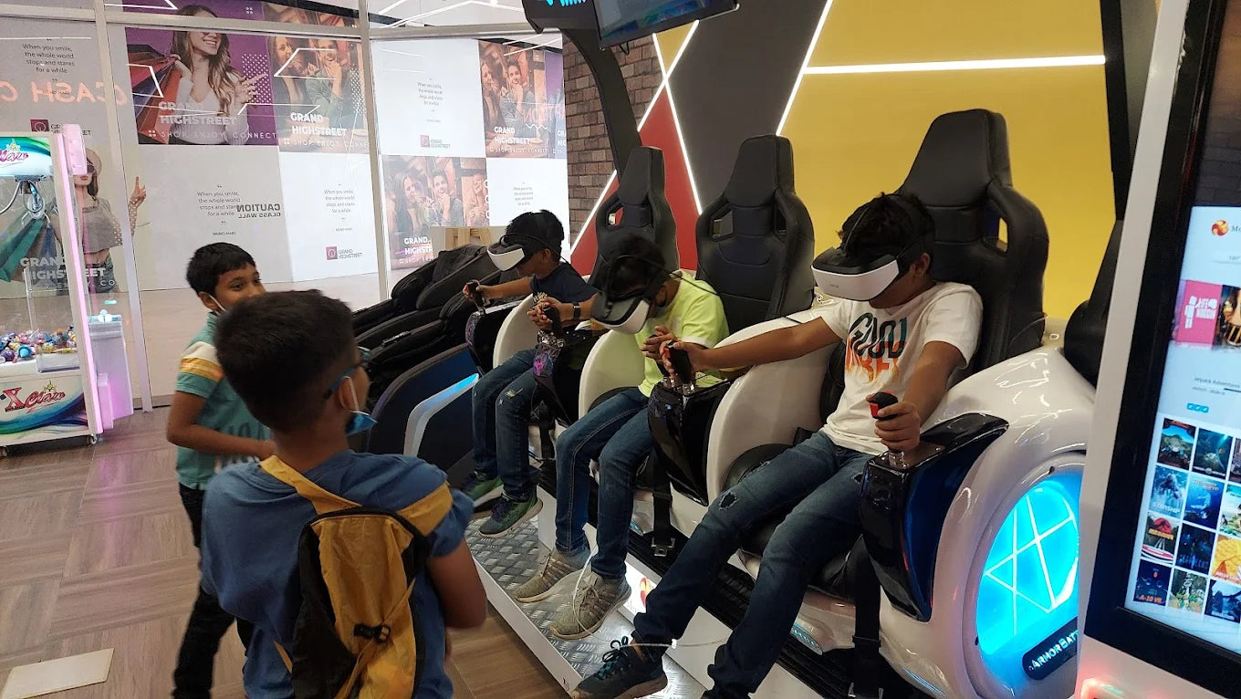 Children wearing VR headsets play a virtual reality game in a brightly lit arcade.