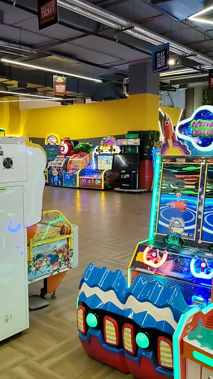 Arcade with colorful games and signs for tickets and prizes.