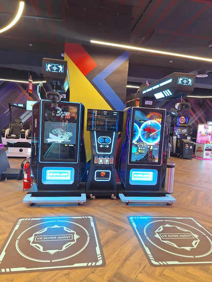 VR arcade with multiple gaming stations and "VR Super Agent" mats on the floor.