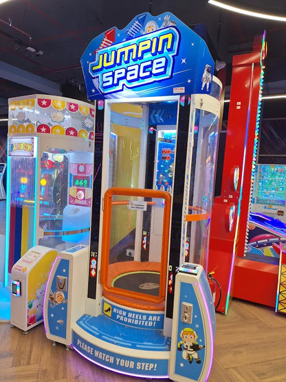An arcade game called "Jumpin Space" with a trampoline inside. A sign warns "High heels are prohibited!"