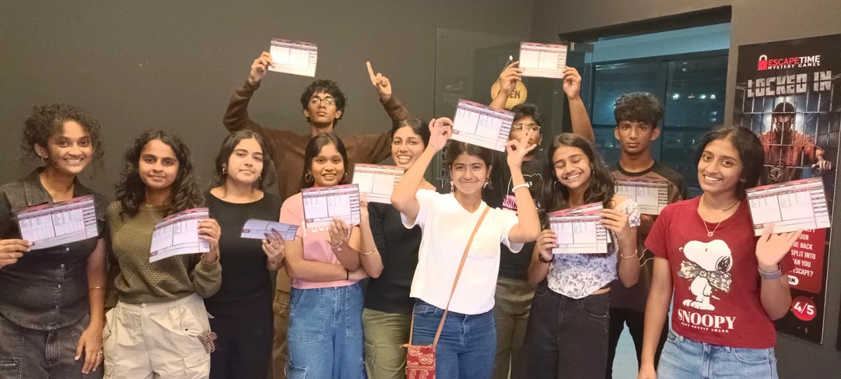 A group of young adults poses for a photo, holding up papers after completing an escape room challenge.