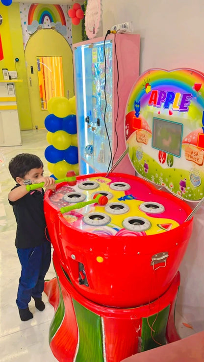 Child playing with a colorful toy in a bright, decorated room