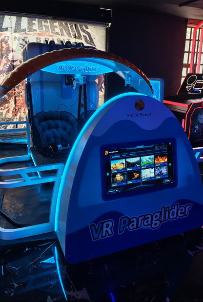 A VR paraglider ride in an arcade, with a screen displaying game options.