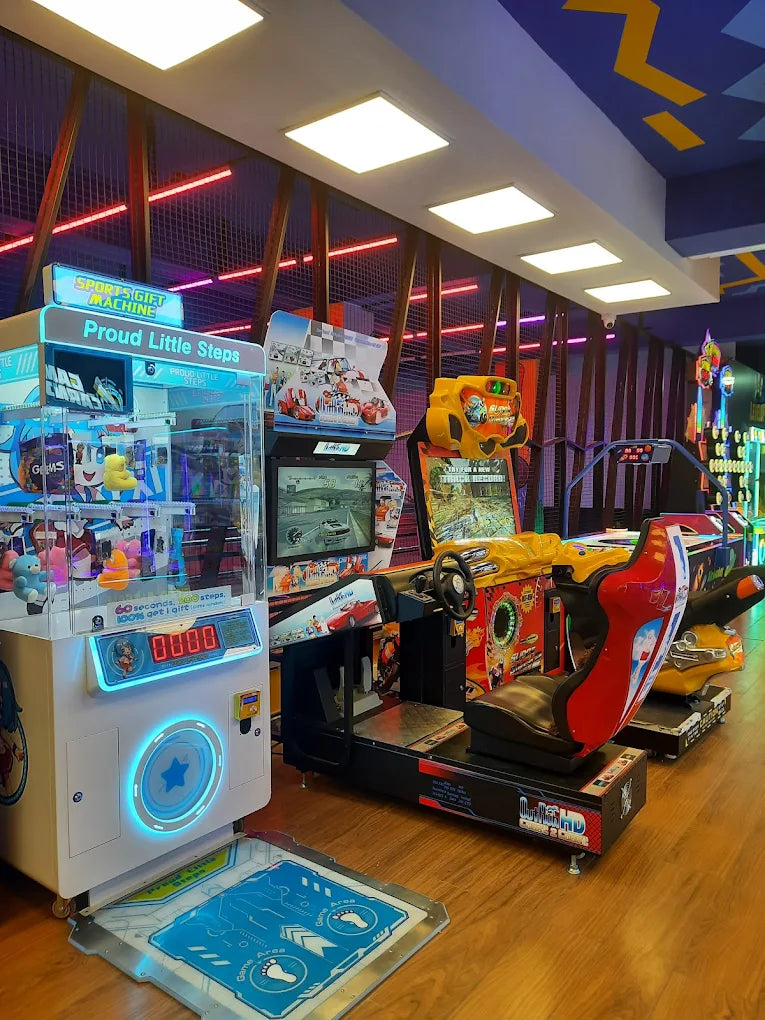 Arcade with racing games and a claw machine.