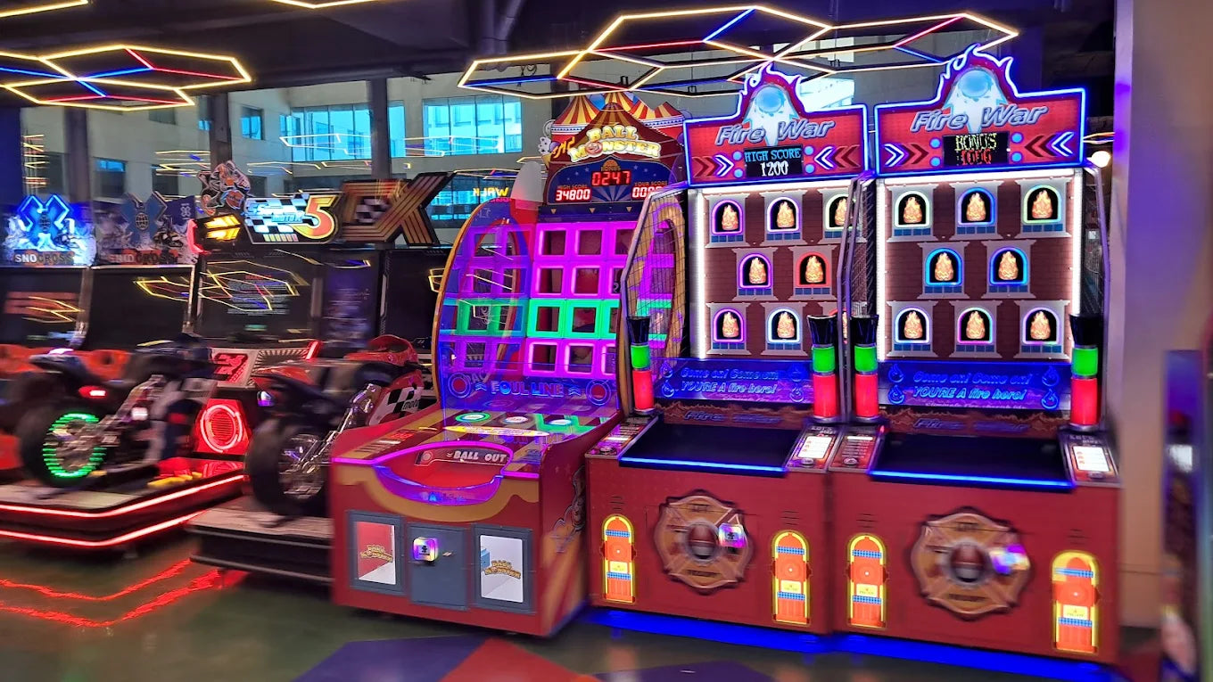 Arcade with racing games and "Fire War" machines.