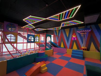 Colorful indoor playground with geometric patterns and neon lights
