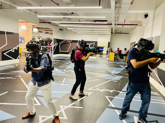 Three individuals with cameras in a modern indoor setting