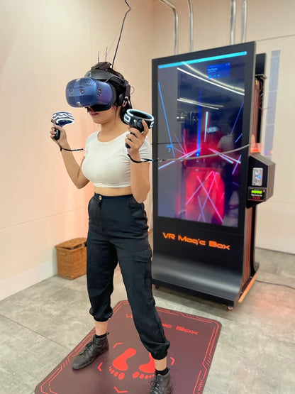 Person using VR equipment in front of a VR Magic Box device.