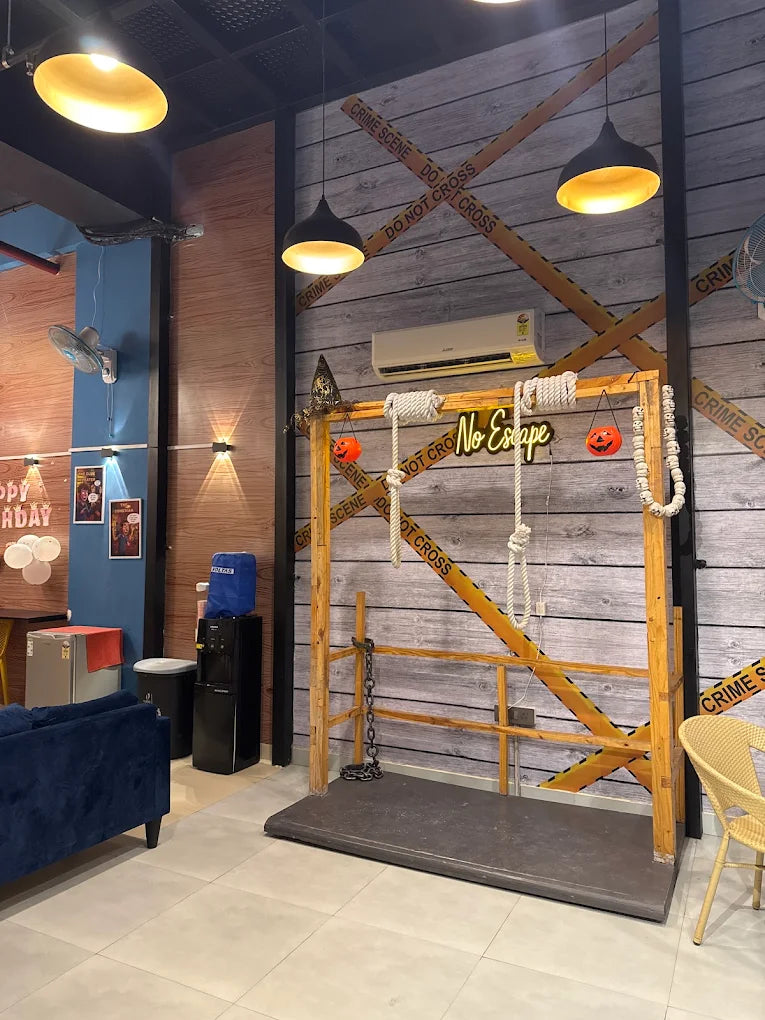 A spooky-themed room with "Crime Scene" tape, a swing, and Halloween decorations.