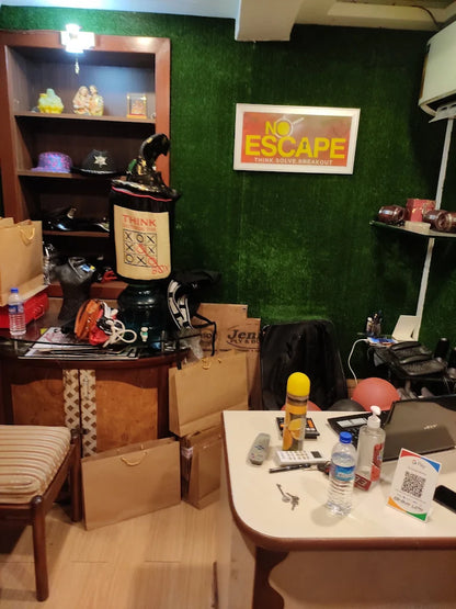 A cluttered room with shopping bags, a desk, and a "No Escape" sign.