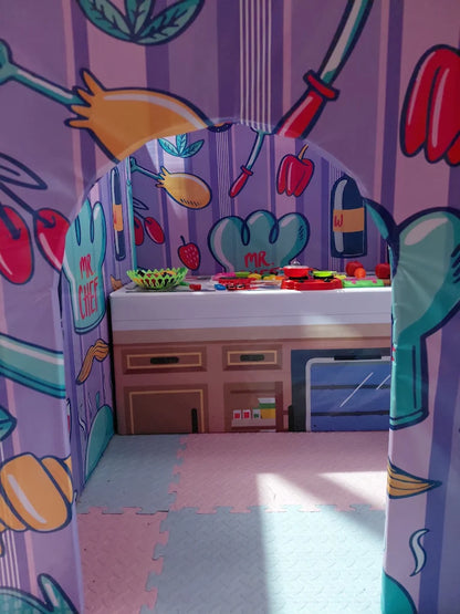 A child's play kitchen with cartoon food and utensils.