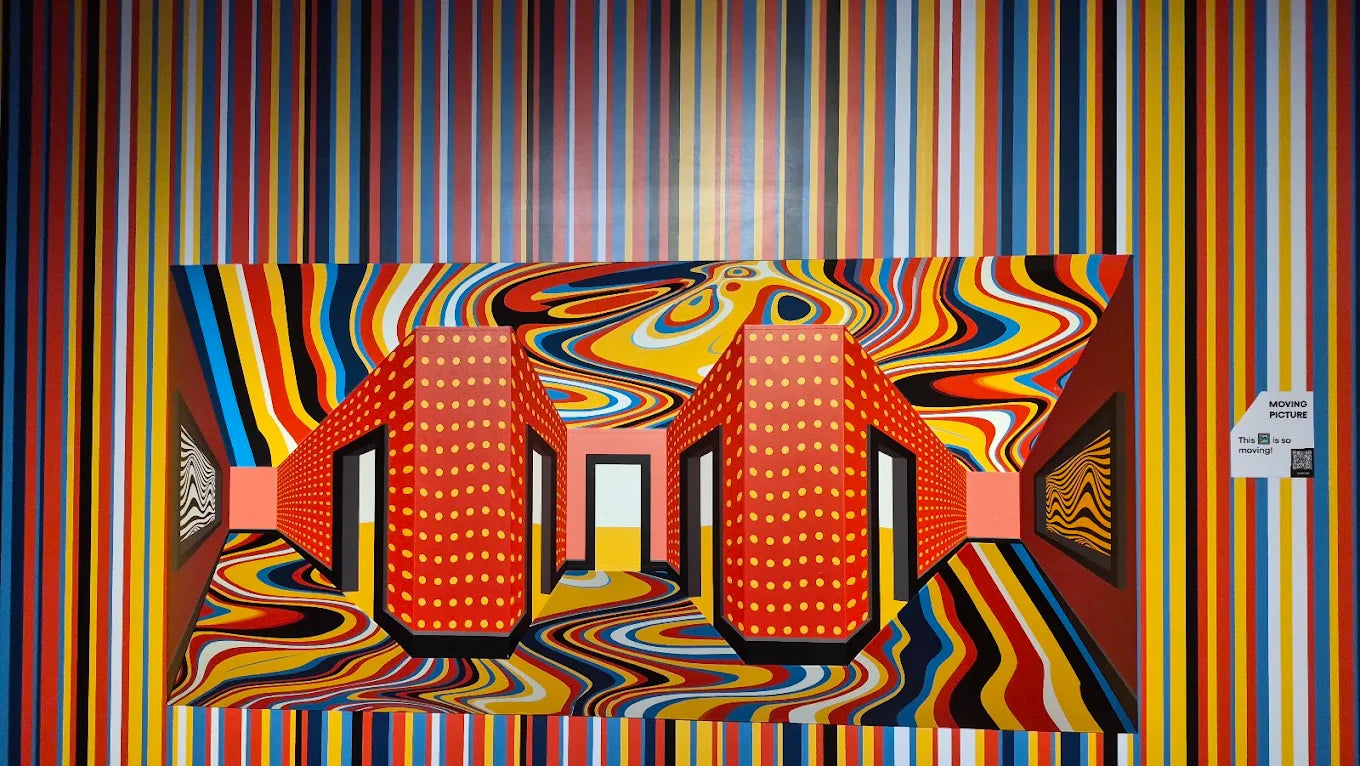 An optical illusion art installation with colorful stripes and swirling patterns.