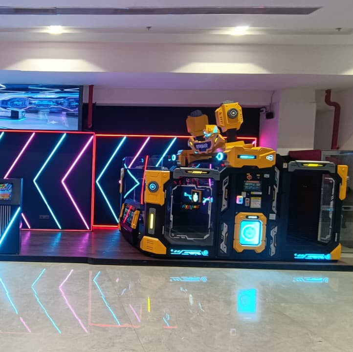 A futuristic arcade game with yellow and black panels and neon lights.