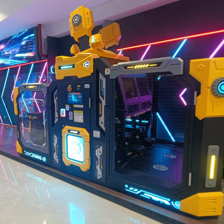 A futuristic arcade game with yellow and black accents and neon lights.