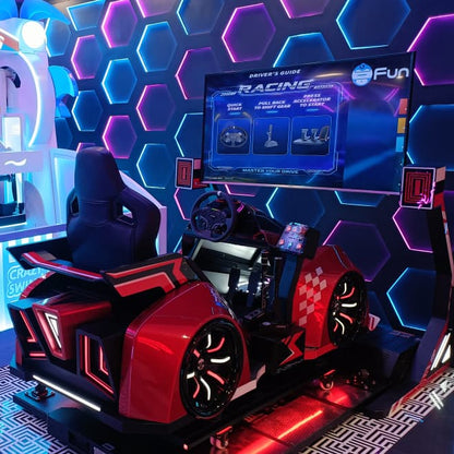 A racing arcade game with a red car seat and a large screen displaying game instructions.