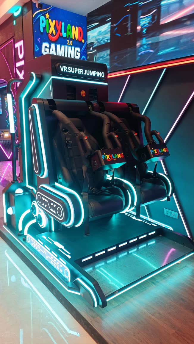 A VR gaming ride with two seats and neon lights.
